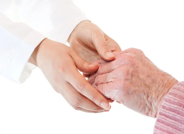 Doctor sosteniendo las manos de la señora mayor — Foto de Stock