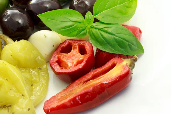 Pickled peppers and olives — Stock Photo, Image