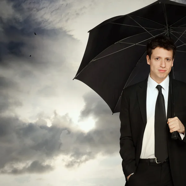 Snygg man med paraply — Stockfoto