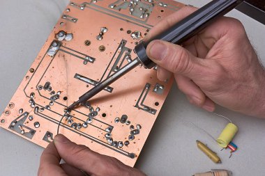 Repair of circuit board clipart