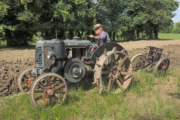 stock image Plowing with old tractor
