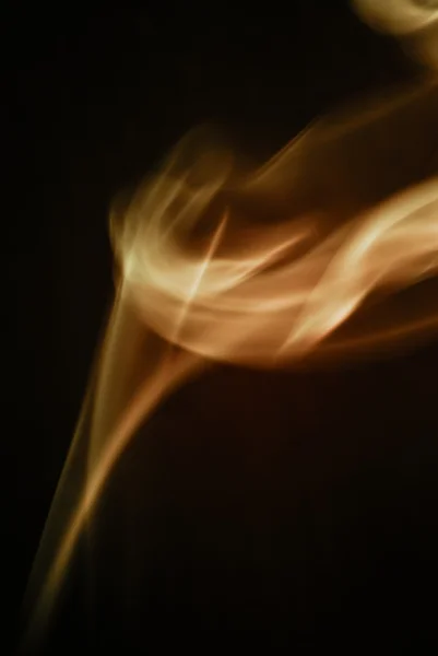 Oranje rook abstract op een zwarte achtergrond — Stockfoto