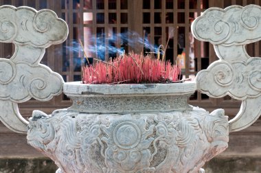 Burning Incense in a Buddhisttemple clipart