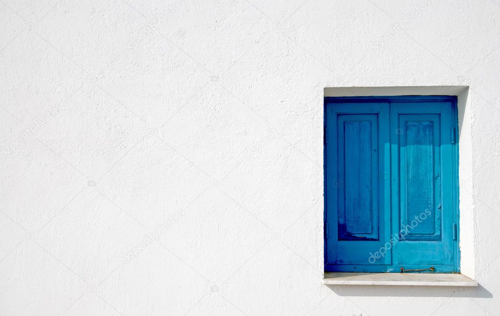 Blue window on a white wall
