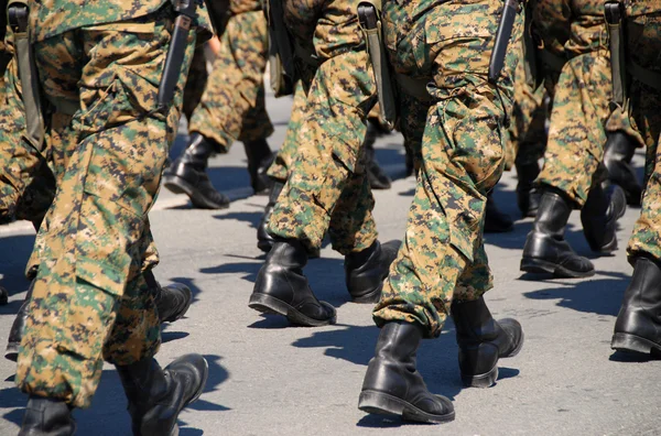 stock image Military soldiers with uniforms and guns.