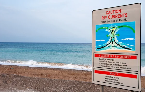 Warnschild für gefährliche Wellen — Stockfoto