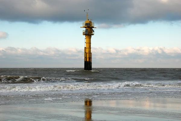 Lighthouse in the surf — Stock Photo, Image