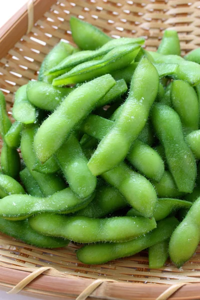 Edamame nibbles, boiled green soy beans — Stock Photo, Image