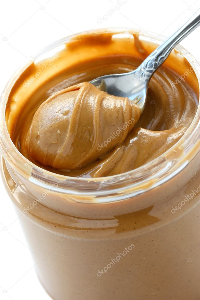 Premium Photo  Glass jar and spoon full of peanut butter isolated on white