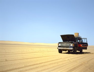 Broken down 4WD in the desert clipart
