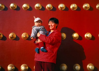 Mother with baby in Beijing clipart