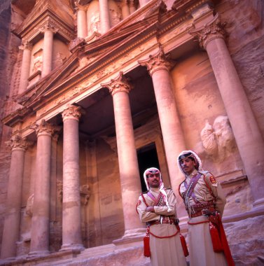 Military guards at the Treasury in Petra, Jordan. clipart