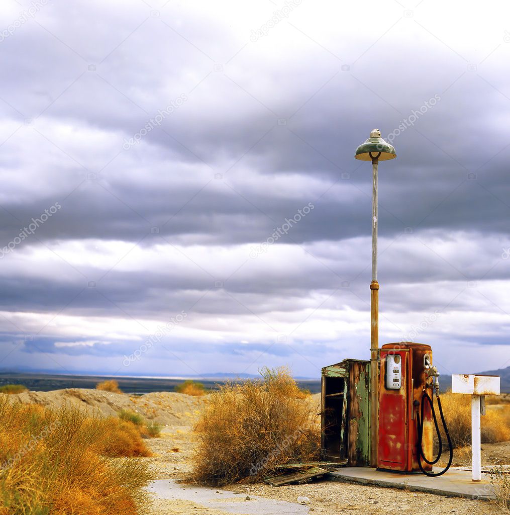 Old gas pump at border of the desert