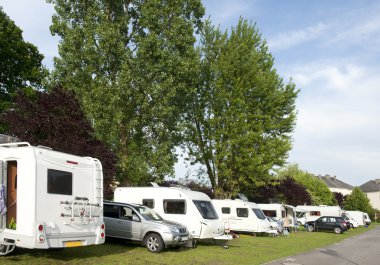 Caravans and campers at camping site clipart