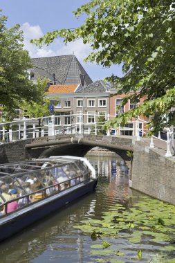 Tourist sightseeing boat in Delft clipart