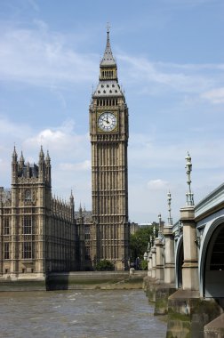 Big Ben and Parliament on the Thames River in London clipart