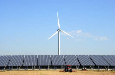 Solar plant with wind turbine at a farm clipart