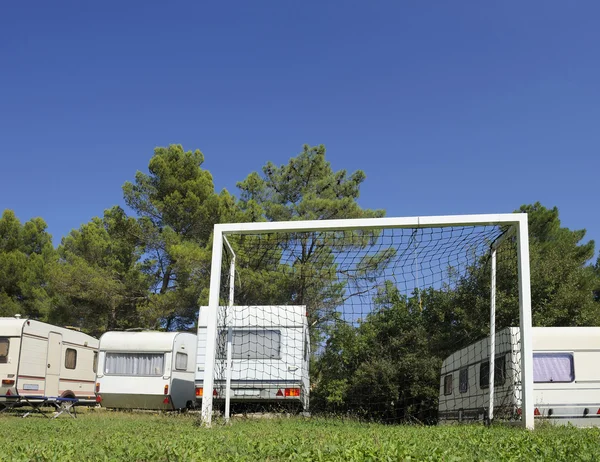 Caravans and soccer goal — Stock Photo, Image