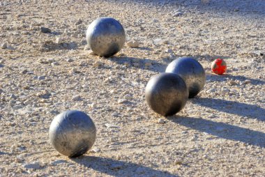 Playing jeu de boules in France clipart