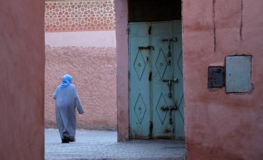 Moroccan woman in djellaba clipart