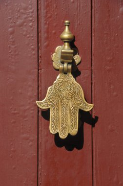 Old knocker in the shape of a hand clipart