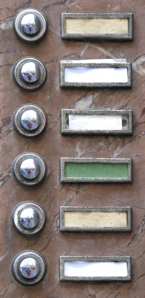 Old apartment buzzers - names removed — Stock Photo, Image