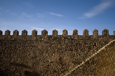 Parapet walk of a fortress. Stairway and merlons. clipart