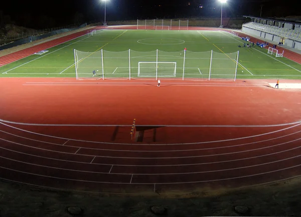 Estádio de atletismo à noite — Fotografia de Stock