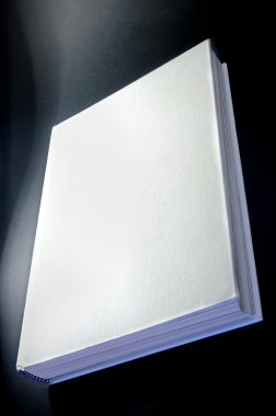 White book isolated on black background clipart