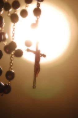 Rosary Backlighting in Mystical Atmosphere clipart