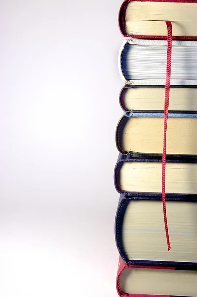 stock image Stack of Books in a tower with a red bookmark