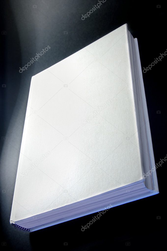 White book isolated on black background