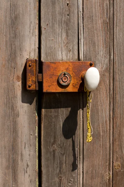 Ancient Wooden Door with Metal Grungy Lock. — Stock Photo, Image