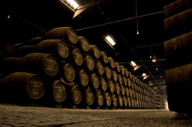 Porto wine Barrels in a warehouse clipart