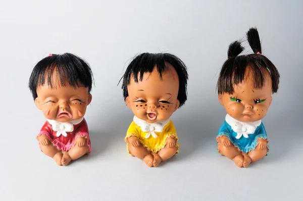 Trio of dolls with different emotions — Stock Photo, Image