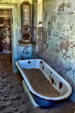 A bathroom at kolmanskop ghost town near luderitz namibia clipart