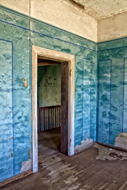 An old house in kolmanskop's ghost town in namibia africa clipart