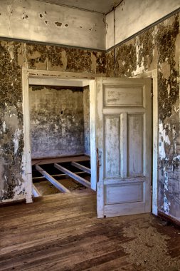 Interior of an house in kolmanskop's ghost town namibia clipart