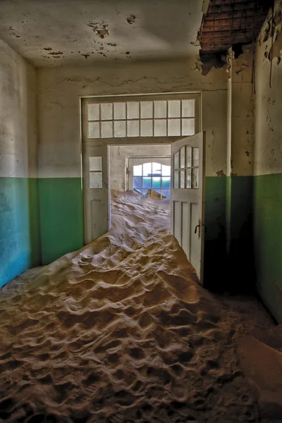 A strange dune in a house at kolmanskop ghost town namibia africa — Stock Photo, Image