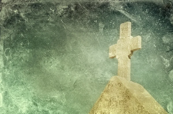 Vintage stone cross on grunge background — Stock Photo, Image