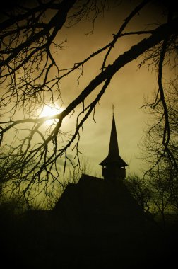 Church silhouette at sunset in Transylvania clipart