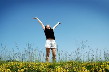 Beautiful young girl enjoying sunshine clipart