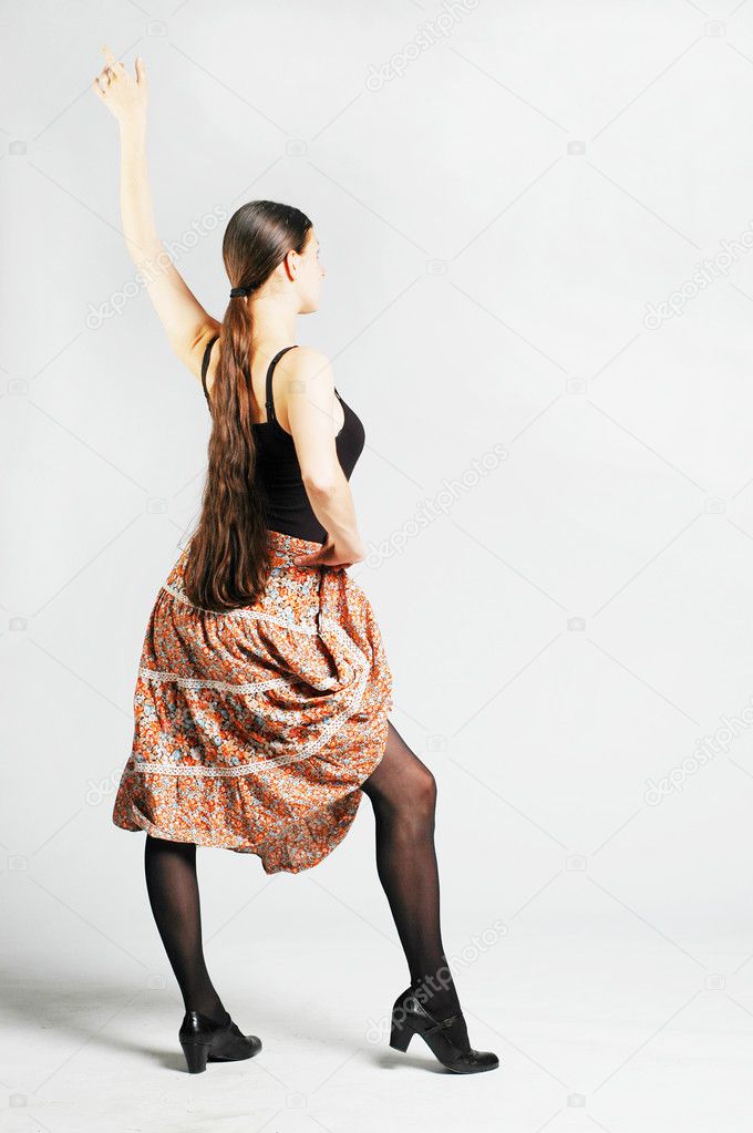 Young dancer woman with color skirt