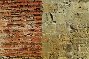 Old wall with bricks and stones. Pisa, Italy clipart