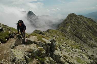 A climber girl who arrives at the summit clipart