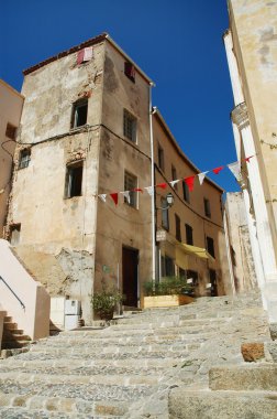 Narrow street of Calvi, Corsica clipart