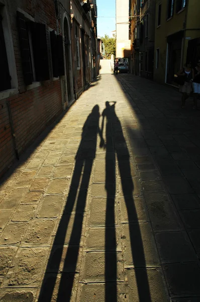 stock image Shadow of walking lovers