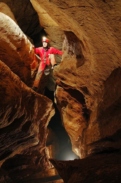 Cave passage with caver — Stock Photo, Image