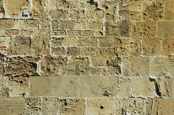 Oude muur met bakstenen en stenen. Pisa, Italië — Stockfoto