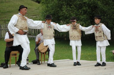 A group of dancers in traditional clothes clipart